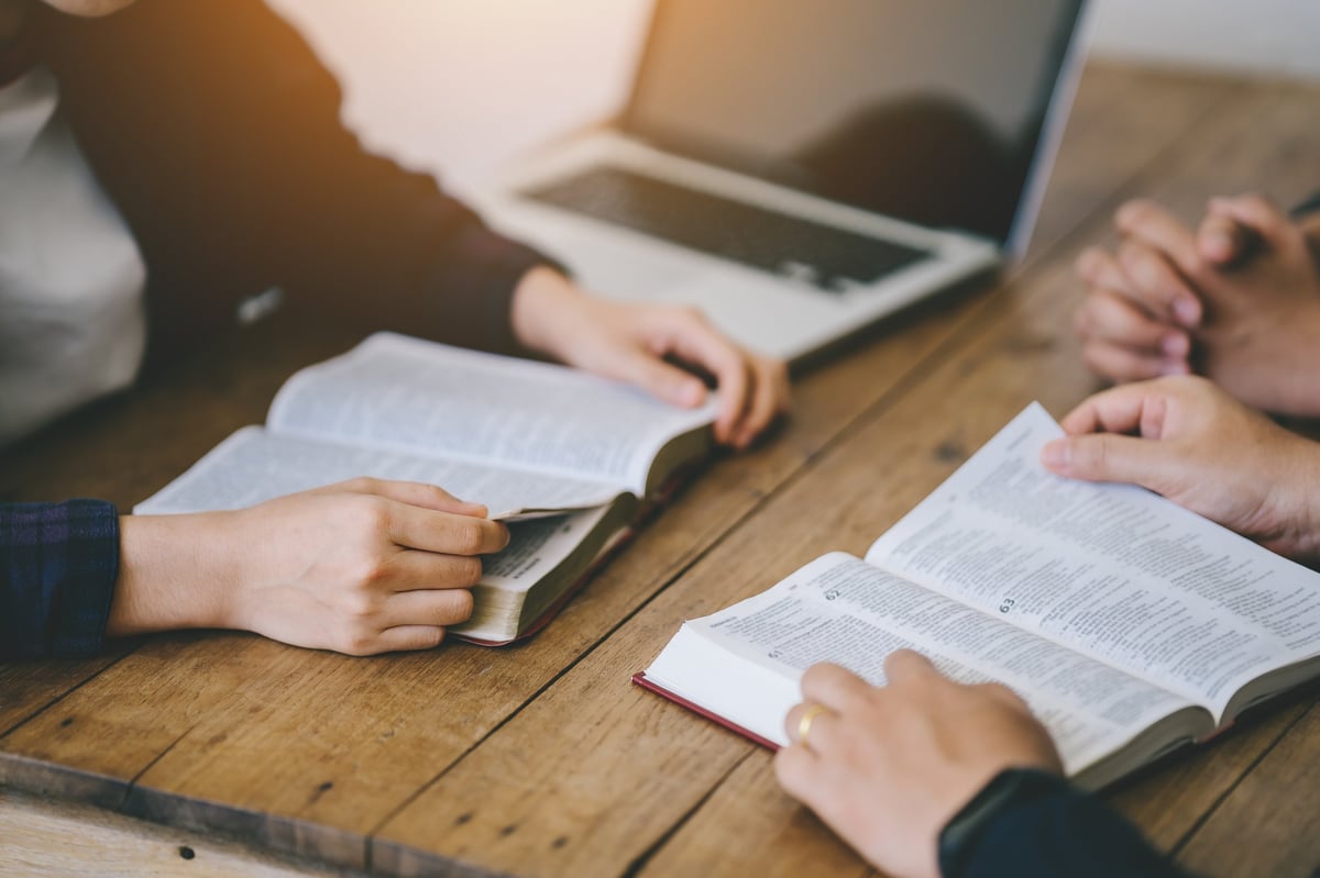 A diverse group of friends studying the Bible together
