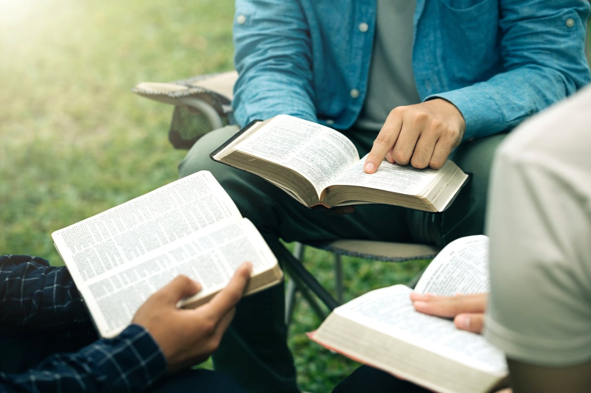 A diverse group reading and studying the Bible together
