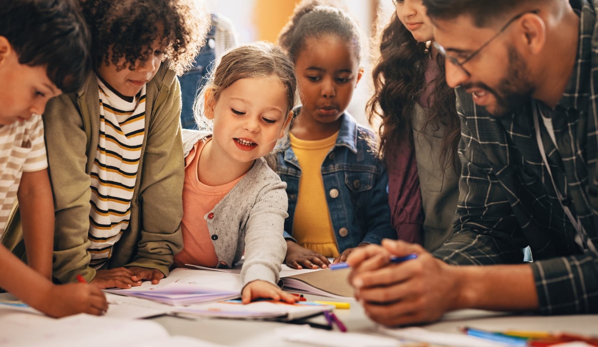 A diverse group of children learning and creating together