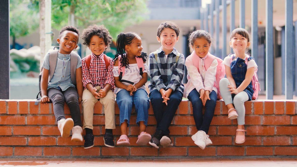 A diverse group of smiling children together